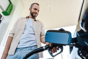 Driver refueling car at a WEX Motorpass location