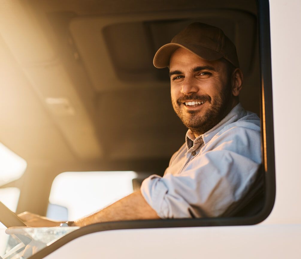 A driver refuelling his vehicle at a WEX Motorpass location, using Pay2Go Prepaid Fuel Card for a seamless payment experience