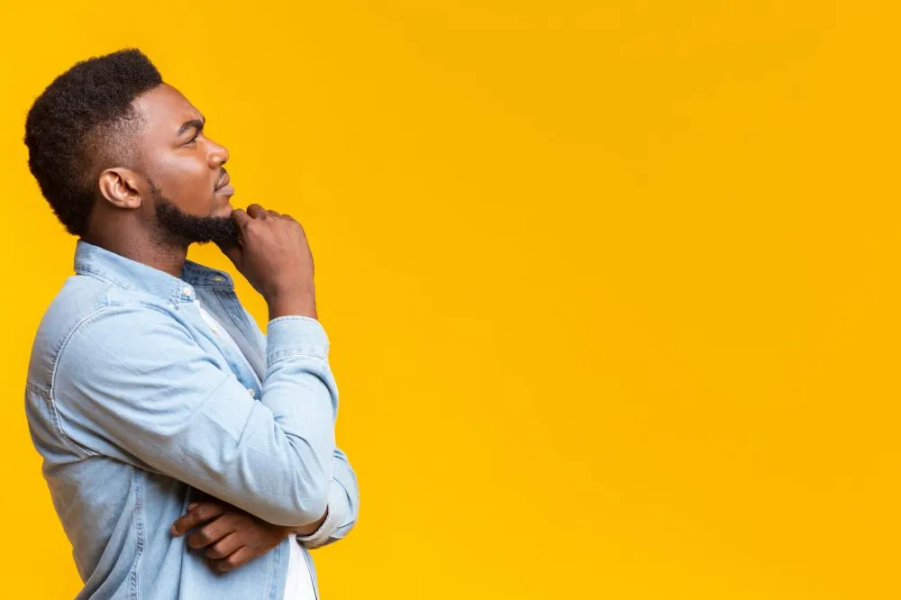 Business owner thinking about ways to save money using a fuel card for better expense management