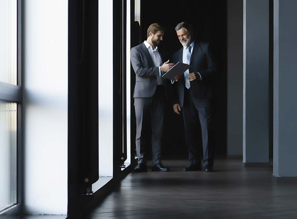 Men talking in business setting