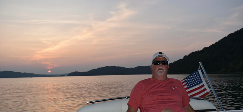 Rick catches the sunset on a boat in Dale Hollow.