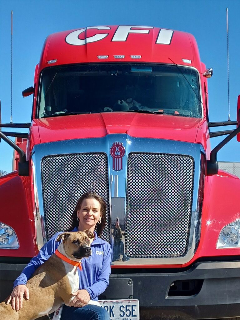 Endrea and her dog, Sanza on the road delivering freight for CFI