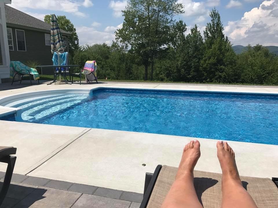 Mindy lounging by the pool