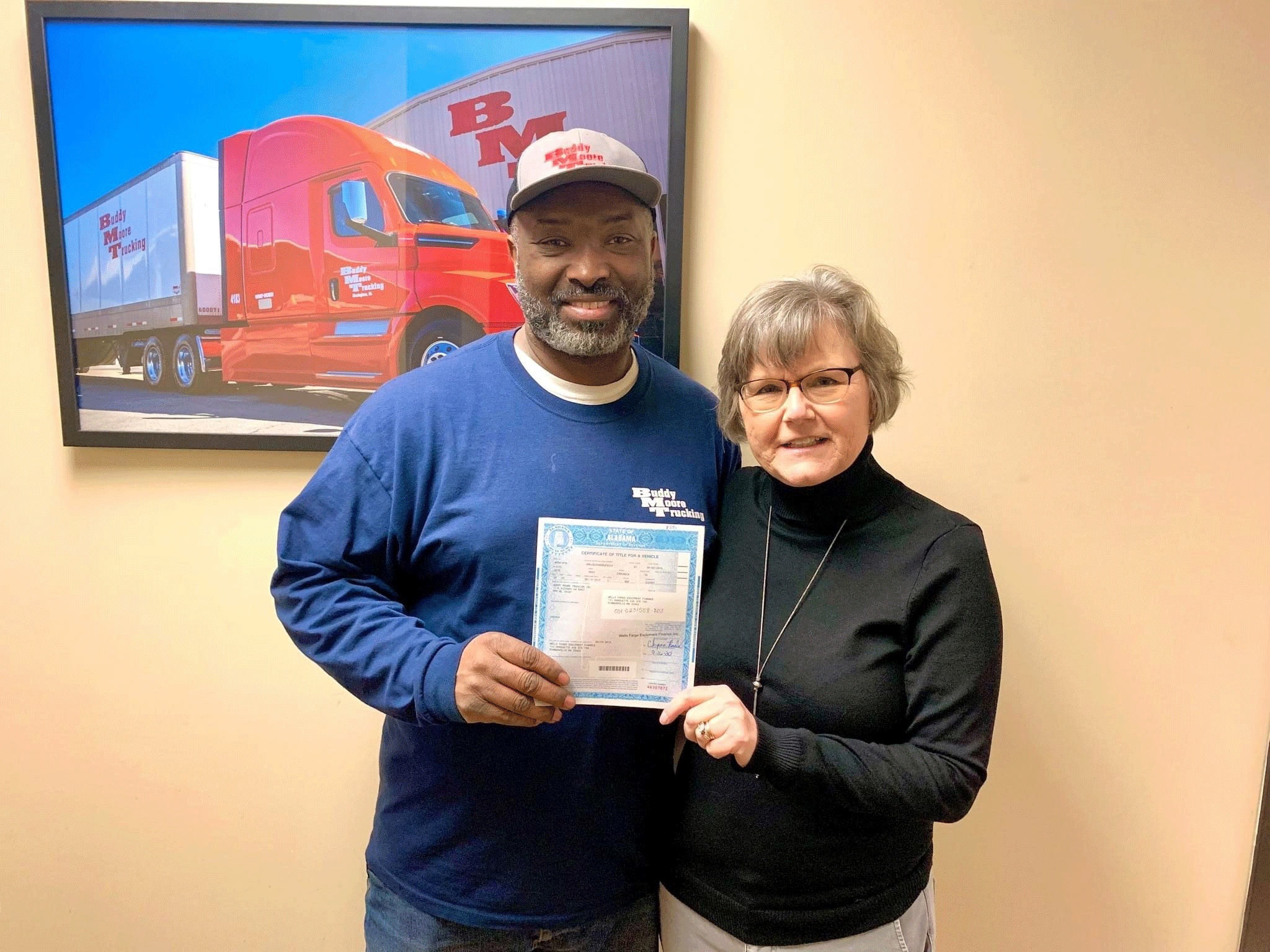 Susan with Theodis Washington, a Buddy Moore Trucking employee 