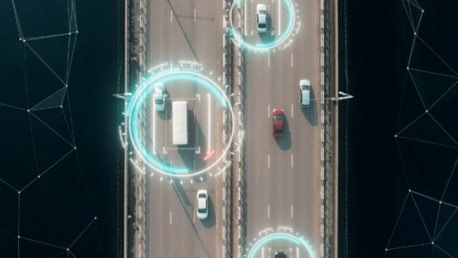 Overhead shot of vehicles on a highway, with blue radar circles.
