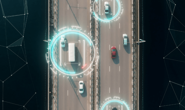 Overhead shot of vehicles on a highway, with blue radar circles.