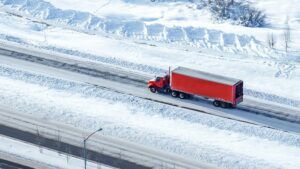 truck drives through snowy landscape