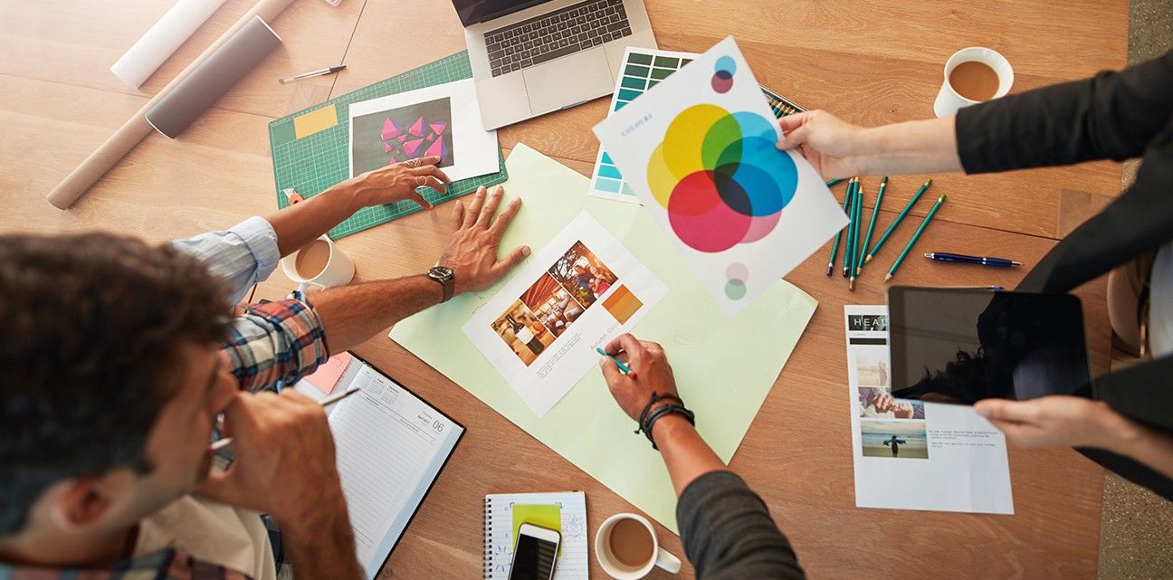 A team works on developing their company's brand