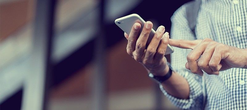 person using mobile device for social media