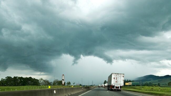 A tornado begins forming in the distance