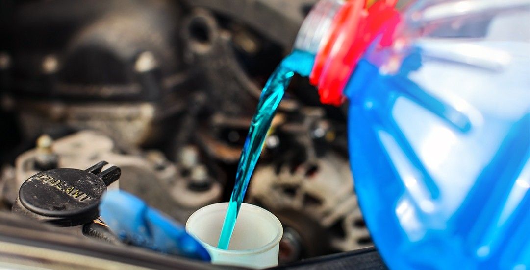 wiper fluid being poured