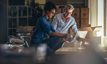 Small business owners in warehouse