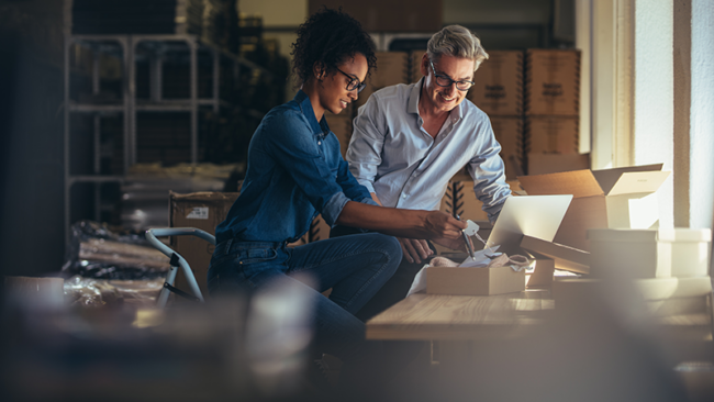 Small business owners in warehouse