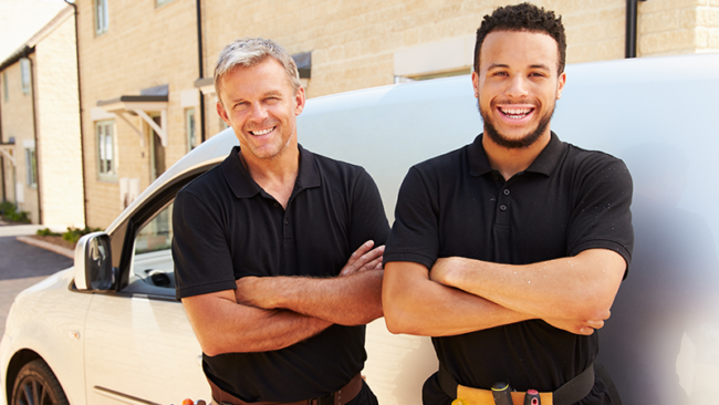 workers in front of van